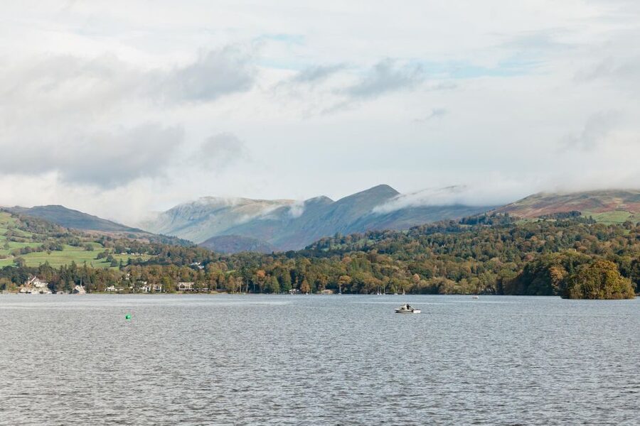 From Manchester: Lake District Bus Tour & Windermere Cruise - Coniston Water and the road through the fells