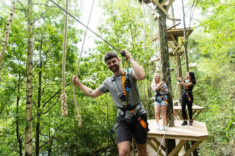 Kent: Treetop High Ropes Adventure Course - Working through two levels of treetop obstacles