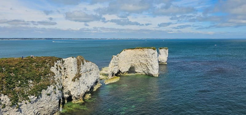 Poole: Old Harry Rocks and Corfé Castle Guided E-bike Tour - Sandbanks and the long golden beach