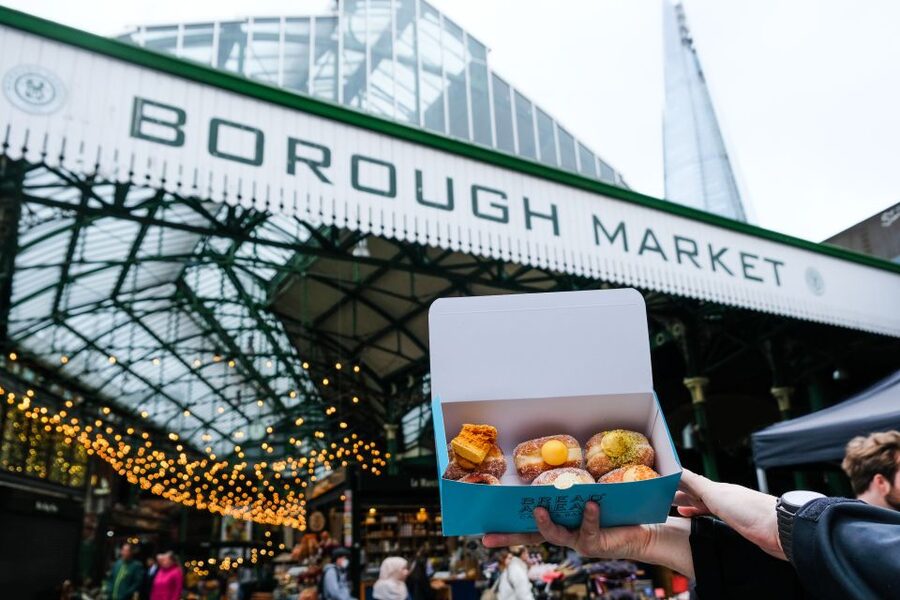 Tea and Doughnuts: Historic Walking Food Tour of Southwark - Walking Borough High Street between bites